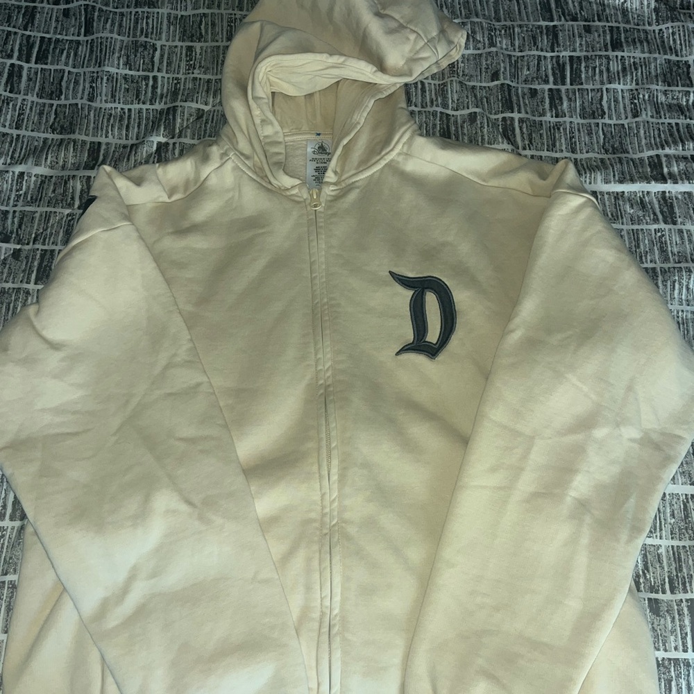 Disney Cream Hoodie with Black and Green Print